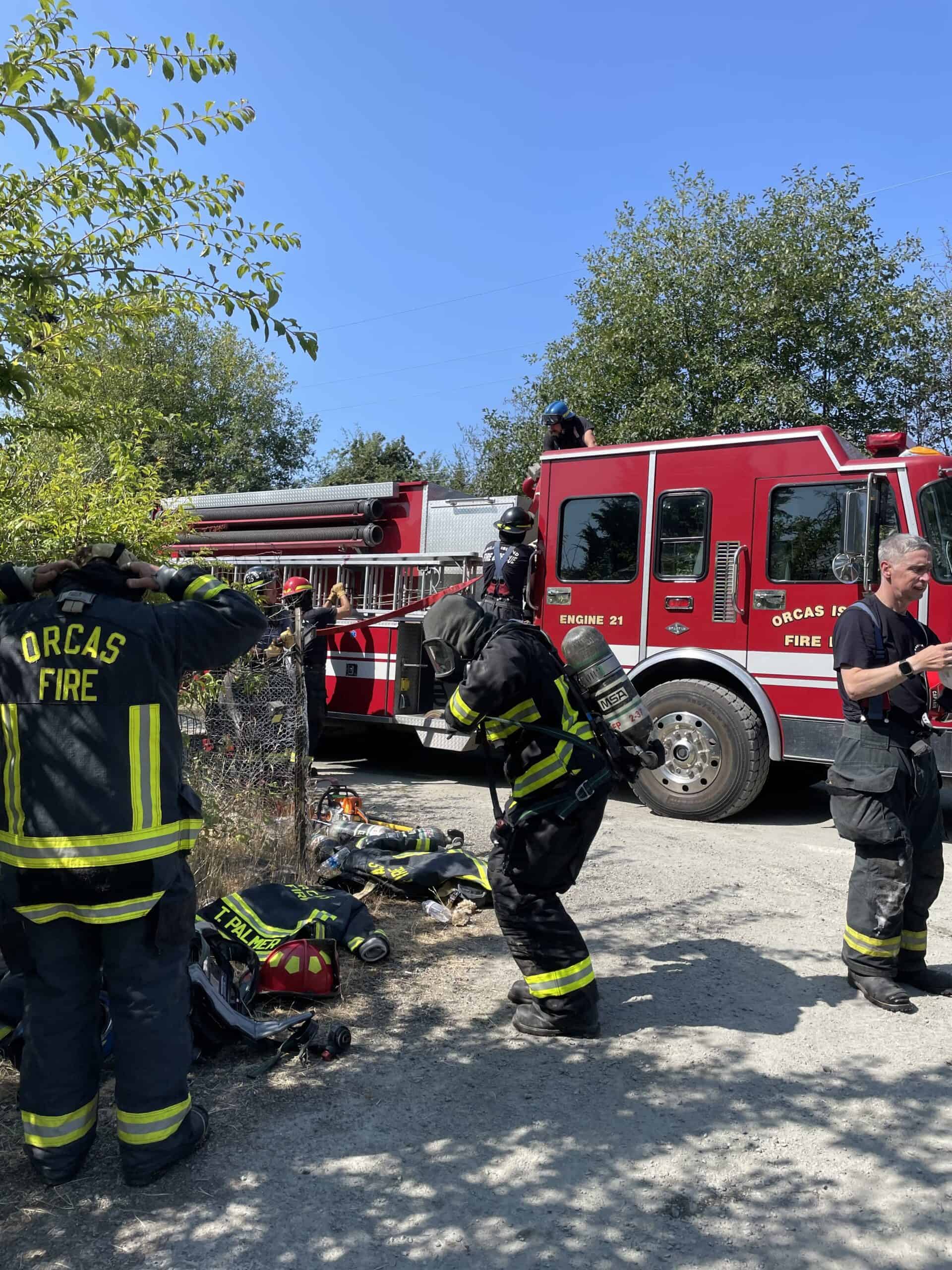 Firefighters prepare to enter the structure for overhaul after the fire was extinguished.